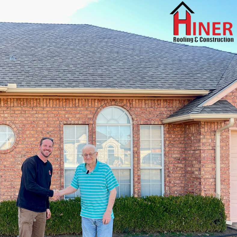 Hiner Roofing with client